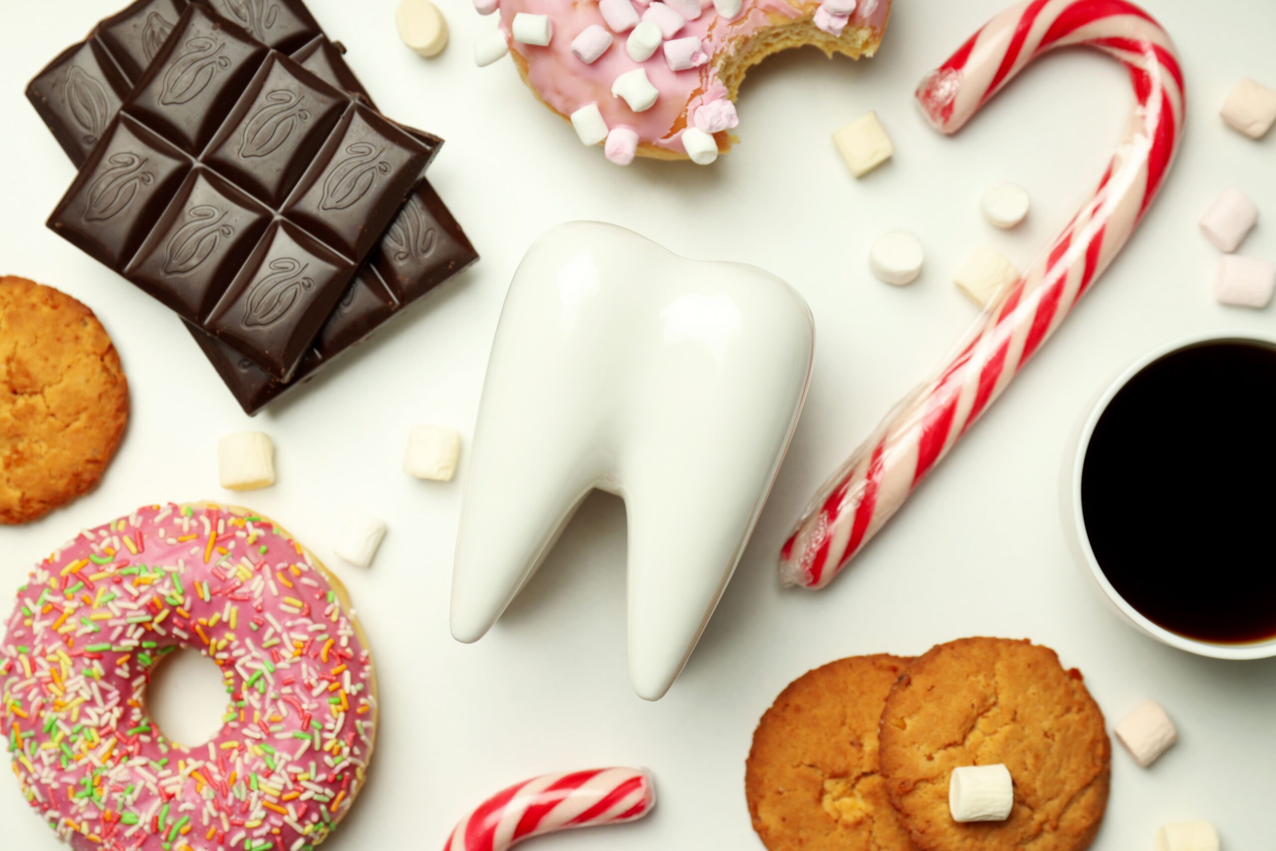 tooth in the middle of sugary foods