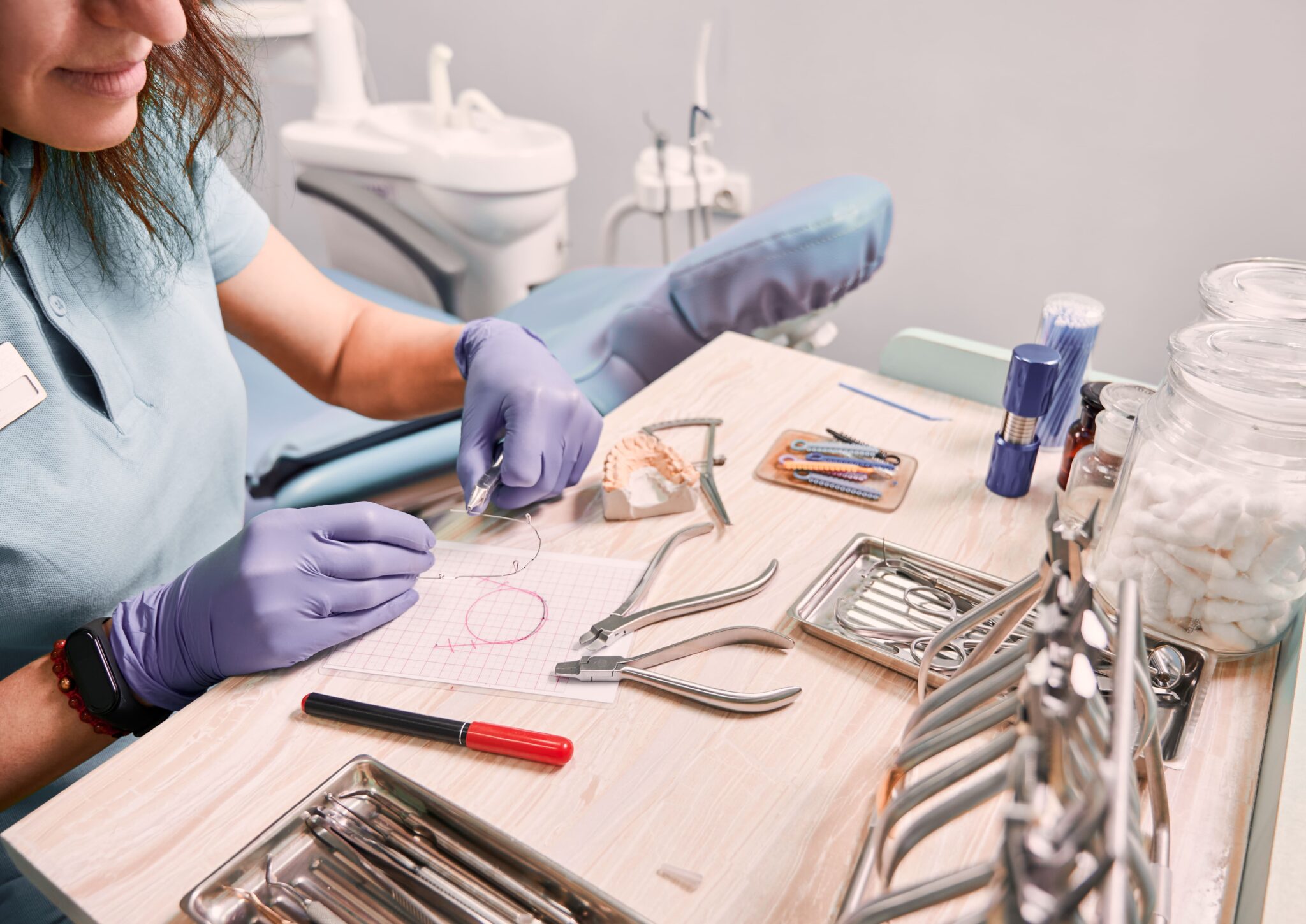 female orthodontist working in dental office