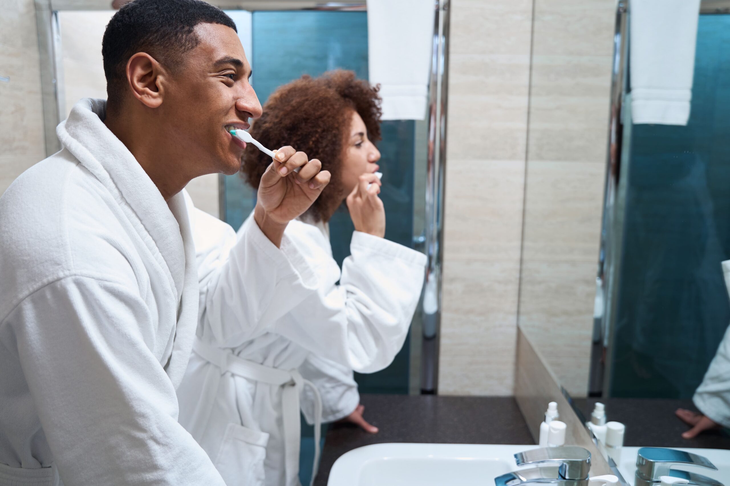 couple brushing their teeth