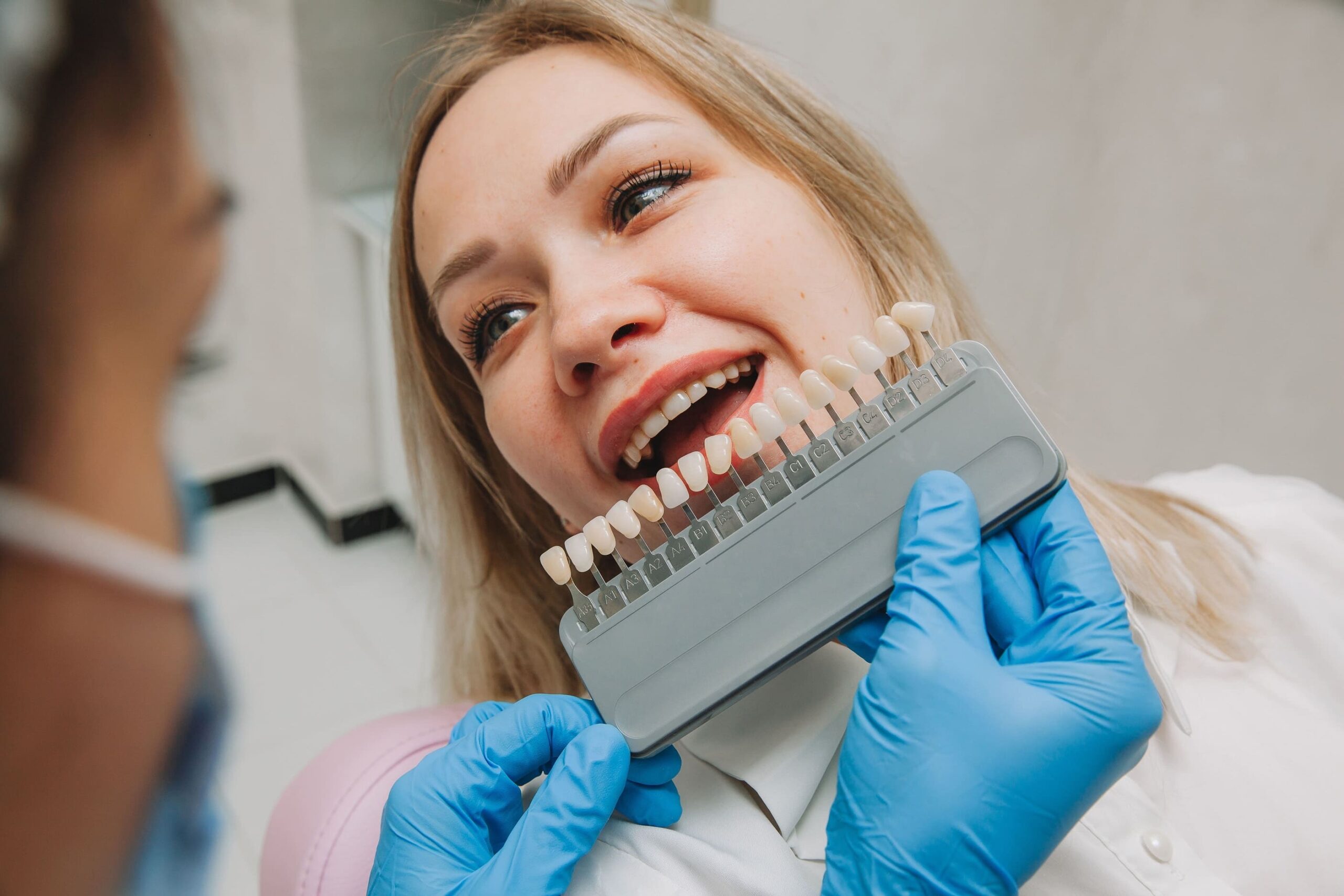 dentist choosing veneer color